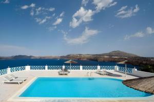 a swimming pool with a view of the water at Blu Rooms Santorini in Akrotiri