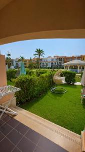 a view of a yard with a swing at Porto Matrouh unique Chalet in Marsa Matruh