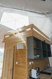 a kitchen under a tent with a sink at Glamping Prague Louka in Prague +22 photos