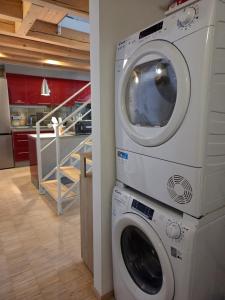 a washer and dryer in a room with a kitchen at Apartmán Kräm in Klatovy