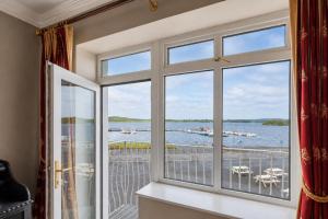 a window with a view of the water at Lakeside Manor Hotel in Virginia