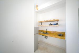 a kitchen with a sink and a counter at Sand House in Imsouane +38 photos