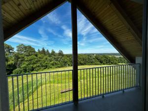 a view from the balcony of a house at Barn House in Ptuj +4 photos