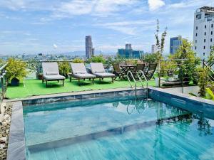 a swimming pool on top of a building at MiAn Hotel Danang - Infinity Pool in Danang