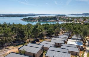 an aerial view of a row of buildings next to a river at Luxury Homes Pašman in Pašman