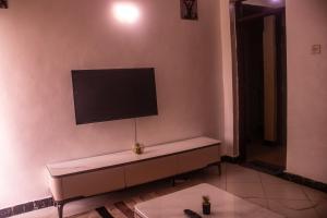 a flat screen tv on the wall of a room at Cisa Homes in Gatunga