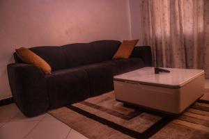 a living room with a couch and a coffee table at Cisa Homes in Gatunga