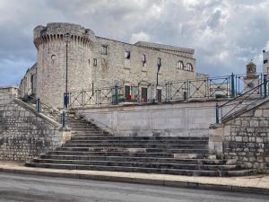 a large castle with stairs in front of it at Borgo Sant' Angelo Exclusive House in Conversano