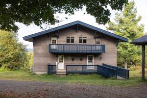 an old house with a porch and a balcony at 168 Secluded Acres Trails, Winery 5BR in Floyd