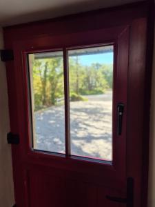 a close up of a door with a window at Waterfall Cottage in Killybegs