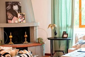 a living room with a fireplace and a couch at Apartment Panzano in Panzano +10 photos