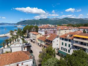 a view of a city with the water and buildings at Hotel Montenegrino in Tivat