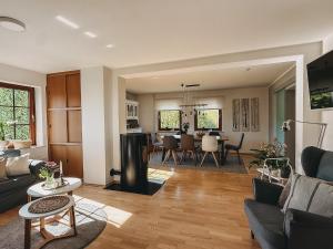 a living room with a couch and a table at Feriendorf Falkenegg in Lennestadt