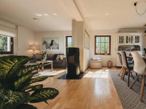 a living room with a couch and a table at Feriendorf Falkenegg in Lennestadt
