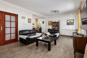 a living room with a couch and a table at Villa MontAnja in Herceg-Novi