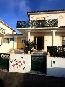 a house with a sign that says its for sale at Vio's Home in Serra de El-Rei