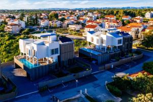 an aerial view of a city with white buildings at Dedaj Resort - Villa Delux with Sea View Pool in Zadar