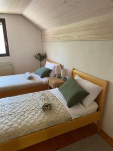 a bedroom with two beds and a window at Holiday Chalet near Bled in Obrne