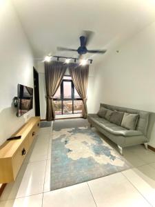 a living room with a couch and a window at K Avenue by FRHome, 2 bedroom apartment within 5 min to KKIA airport in Kota Kinabalu