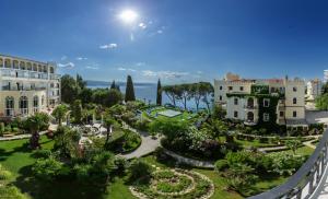 an aerial view of a garden in a resort at Hotel Miramar in Opatija