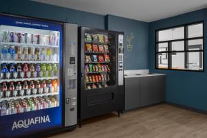 a soda machine in a store with soda drinks at StudioRes by Marriott Denver Tech Center in Centennial