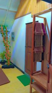 a towel rack in a room with a ladder at Ella Kumi Wood Cabin in Ella