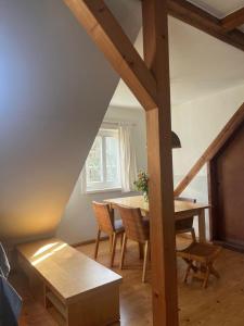 a dining room with a table and chairs at Haus Prälank in Neustrelitz