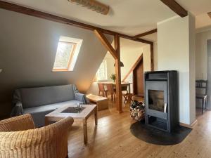 a living room with a couch and a fireplace at Haus Prälank in Neustrelitz