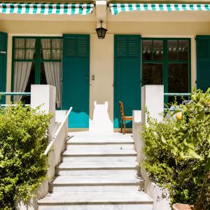 a house with blue doors and stairs at Chambre privée, proche Croisette in Cannes
