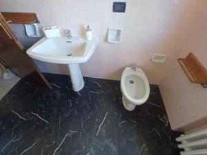 a bathroom with a sink and a toilet at A casa di Nonna in Gambassi Terme +12 photos