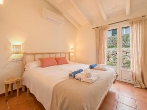 a bedroom with two beds and a window at Villas Menorca Sur by 3VILLAS in Son Bou +65 photos