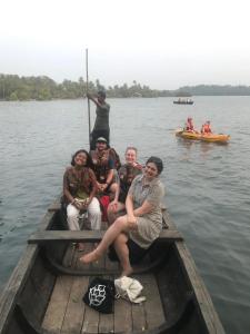 a group of people sitting in a boat on the water at FREEDOM HOUSE, Munroe Island , Kollam - A Backpackers Hostel in Munroe Island +70 photos