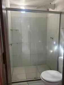 a bathroom with a shower with a toilet at Lar sossego Itabuna in Itabuna
