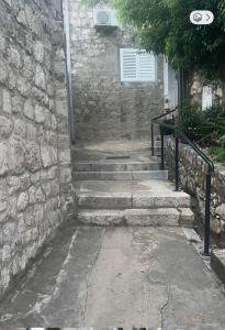 a stone stairway leading up to a building at Main Bus Terminal Rooms in Dubrovnik +1 photo
