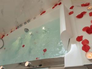a box filled with red hearts on a counter at Bat'Appart -DIJON- Balnéo-insolite-parking gratuit in Longvic +34 photos