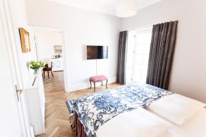 Postel nebo postele na pokoji v ubytování Hotel Fredensborg Store Kro