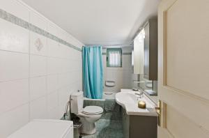 a bathroom with a toilet and a sink at Moschato-Niarchos modern apartment in Piraeus +45 photos