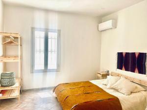 a bedroom with a bed and a window at Anna home Elafonisos in Elafonisos