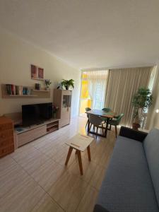 a living room with a couch and a table at El Estudio de Johanna in Puerto de la Cruz