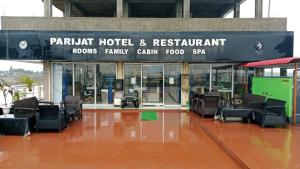 an airport with a waiting area with chairs and tables at countryside view hotel Silchar in Silchar +3 photos