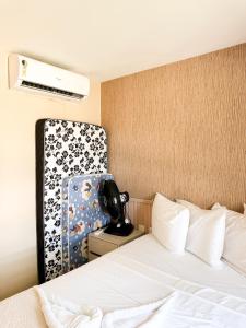 a hotel room with a bed and a chair at Vg Sun Cumbuco 112 in Caucaia +53 photos