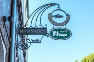 a sign for a restaurant on the side of a building at Hotel Restaurant Zur Eisernen Hand in Viersen