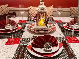 a table with a table set with plates and wine glasses at Quill Corner in Alnwick