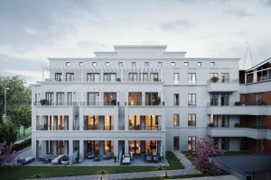 an architectural rendering of a white building at THE SHORELINE Sellin in Ostseebad Sellin
