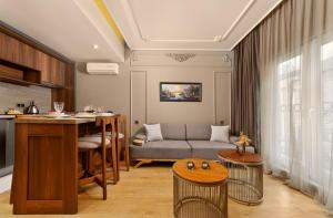 a living room with a couch and a table at Taksim Premium Residence in Istanbul +43 photos