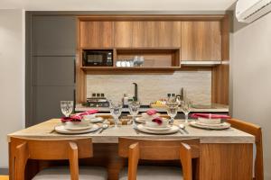 a kitchen with a table with plates and wine glasses at Taksim Premium Residence in Istanbul