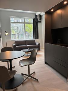 Un televizor și/sau centru de divertisment la CPH Studio Hotel