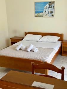 a bedroom with two beds with towels on them at Brother's House in Kallithea Halkidikis