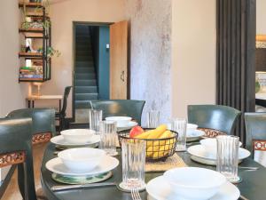 a table with a bowl of fruit on it at The Watertower in Marlborough