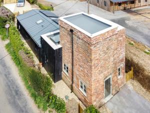 an overhead view of a brick building with a window at The Watertower in Marlborough +11 photos